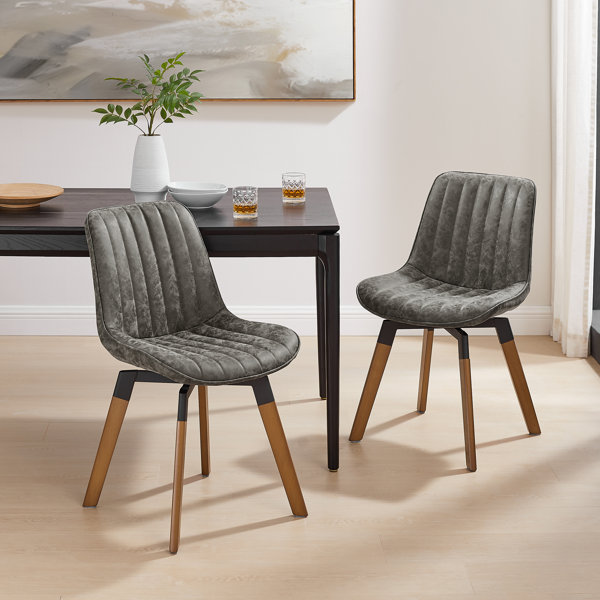 Wade Logan® Bishaan Tufted Faux Leather Upholstered Swivel Dining Side